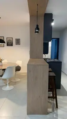 a kitchen and dining room with a table and chairs at Departamento Plaza Colón in Cordoba