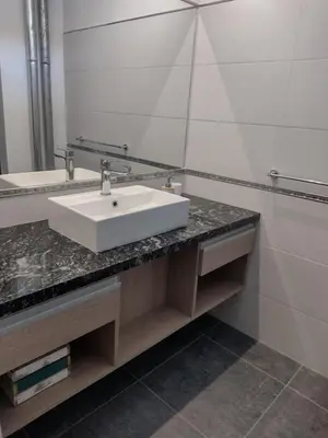 a bathroom with a white sink and a mirror at Tierra Madre in Santa Rosa de Calamuchita
