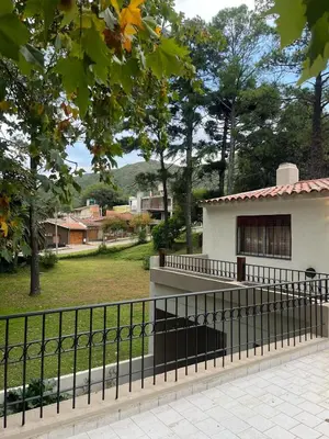 a black fence in front of a building at Tierra Madre in Santa Rosa de Calamuchita