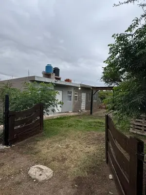 a house with a fence in front of it at Cabañas Antonia in San Javier