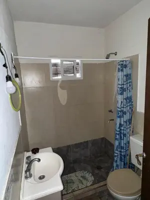 a bathroom with a sink and a toilet and a shower at Cabañas Antonia in San Javier