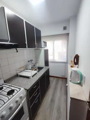 a small kitchen with a stove and a sink at Apartamento Los Capuchinos in Cordoba