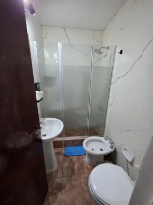 a bathroom with a shower and a toilet and a sink at Apartamento Los Capuchinos in Cordoba