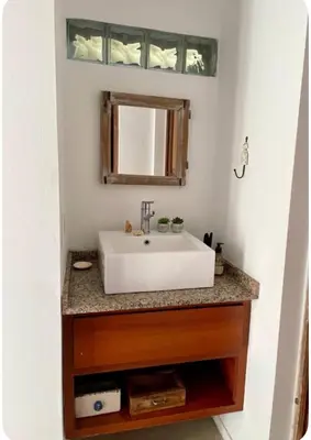 a bathroom with a white sink and a mirror at Casa de huésped in Río Tercero