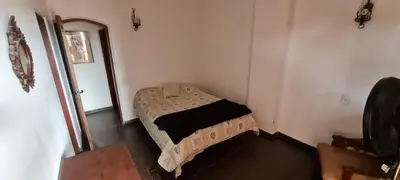 a small bedroom with a bed in a room at Casa Villa Carlos Paz in Villa Carlos Paz
