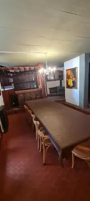 a large dining room with a large table and chairs at Casa Villa Carlos Paz in Villa Carlos Paz