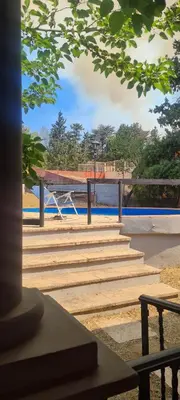 a group of stairs in a park with a bench at Casa Villa Carlos Paz in Villa Carlos Paz