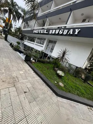 a hotel ultraviolet sign on the side of a building at Hotel Nuevo Uruguay in Villa Carlos Paz