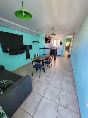 a living room with a couch and a table at General Paz KT I 7 in Cordoba