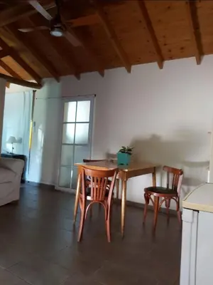 a dining room with a table and two chairs at Ipomeas in Villa Rumipal