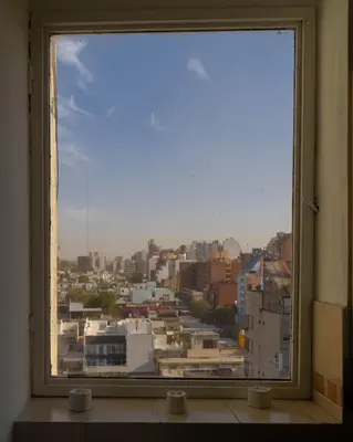 a view of a city from a window at Waru - Vista increíble y ubicación ideal in Cordoba