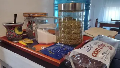 a counter with jars of food on a table at Hospedaje La Dorita in Villa Carlos Paz