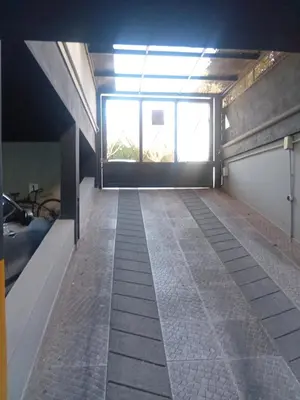 an empty room with a window and a tile floor at Departamento Brisas del Lago in Villa Carlos Paz