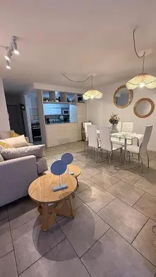 a living room with a couch and a table and chairs at Nueva Córdoba Ejecutivo in Cordoba