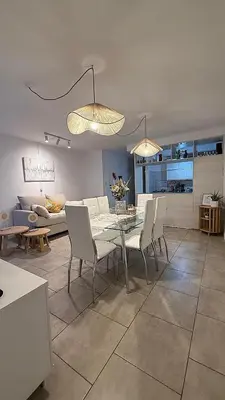 a dining room and living room with a table and chairs at Nueva Córdoba Ejecutivo in Cordoba