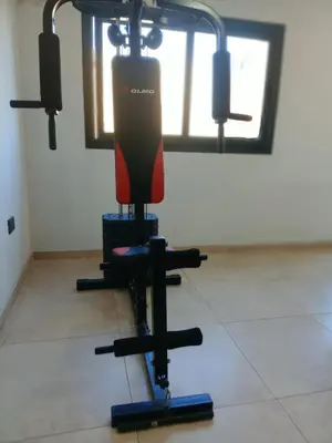 a gym with a red and black equipment in a room at Village Tower - Hermoso departamento en excelente ubicación in Villa Carlos Paz