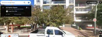a white van is parked on a city street at Village Tower - Hermoso departamento en excelente ubicación in Villa Carlos Paz
