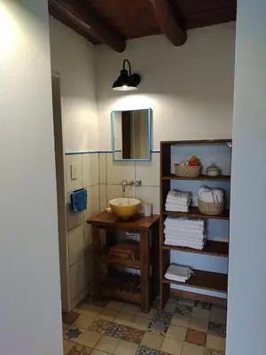 a bathroom with a sink and a mirror at Cabañas La Ramadita in La Ramada