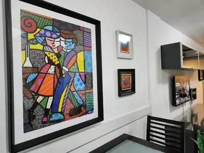 a painting on the wall of a dining room at Beautiful and modern apartment in Alta Gracia in Alta Gracia
