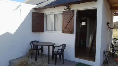 a table and chairs on the outside of a house at Cabañas de Panaholma in Panaholma