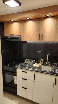 a kitchen with a stove and a counter top at Av General Paz 418 Centro Parking economico in Cordoba