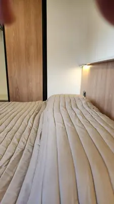a close up of a bed in a room at Av General Paz 418 Centro Parking economico in Cordoba