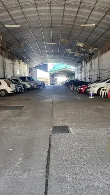 an empty parking garage with cars parked in it at Av General Paz 418 Centro Parking economico in Cordoba