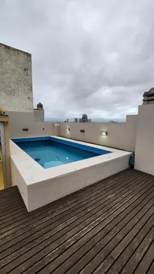 a swimming pool on the roof of a building at Deheza II- Gral Paz-BY Apartments in Cordoba