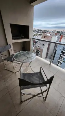 a table and chairs on a balcony with a view at Deheza II- Gral Paz-BY Apartments in Cordoba