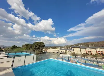 a swimming pool on the balcony of a building at Miralejos 17 in Villa Carlos Paz