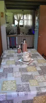 a kitchen with a table with a table cloth on it at Casa particular in San Javier