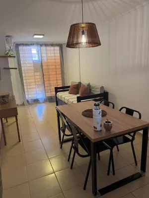 a living room with a table and a couch at Lavalleja II in Cordoba