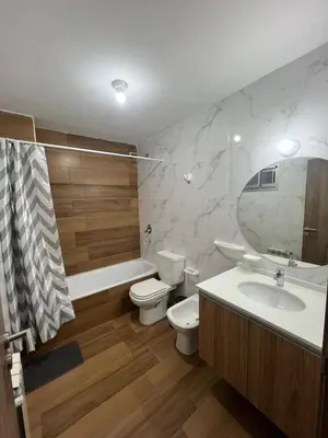 a bathroom with a toilet and a tub and a sink at ALOJATE PREMIUM VILLA CARL0S PAZ -Liniers in Villa Carlos Paz