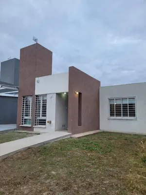 a house with a brown and white at Tu Nuevo Hogar in Alta Gracia