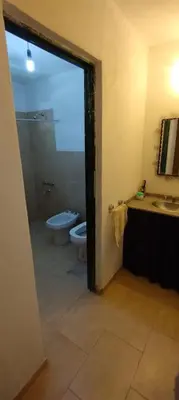 a bathroom with a shower and a toilet and a sink at Pan de Azúcar 3 dias mínimo de alojamiento in Villa Parque Siquiman