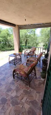 a group of chairs sitting on a patio at Pan de Azúcar 3 dias mínimo de alojamiento in Villa Parque Siquiman
