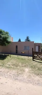 a building with a fence in front of it at Pan de Azúcar 3 dias mínimo de alojamiento in Villa Parque Siquiman