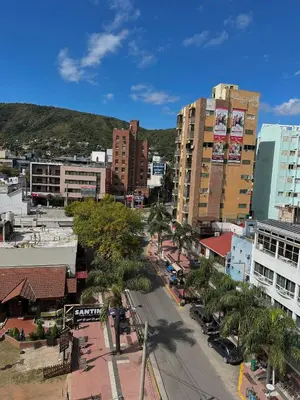 an aerial view of a city with buildings and palm trees at Hotel Toulon in Villa Carlos Paz