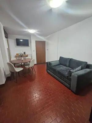 a living room with a couch and a table at Apartment in the City of Cordoba for 4 people and parking in Cordoba