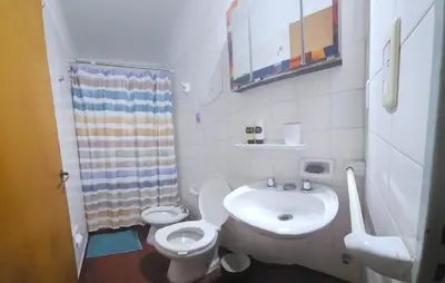 a small bathroom with a toilet and a sink at Apartment in the City of Cordoba for 4 people and parking in Cordoba