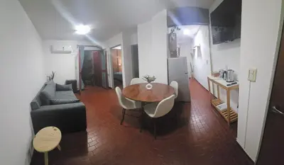 a living room with a couch and a table and a kitchen at Apartment in the City of Cordoba for 4 people and parking in Cordoba