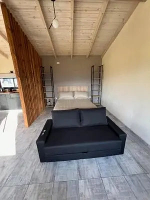 a bedroom with a bed in the middle of a room at algo con sierras in Villa Yacanto