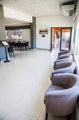 a row of chairs in a waiting room at Clima Sol in Merlo