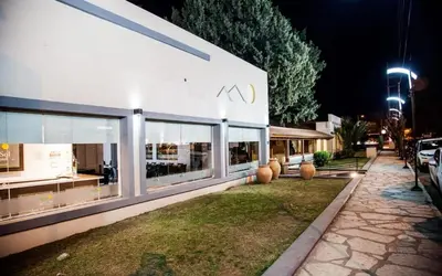 a building with aania sign on the side of it at Clima Sol in Merlo