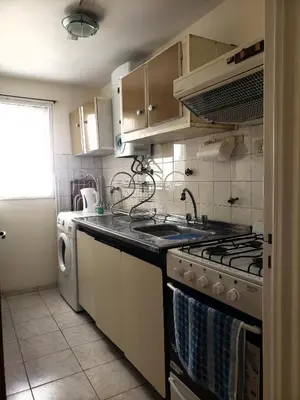 a kitchen with a stove and a dishwasher at Departamento en calle 9 de Julio in Cordoba