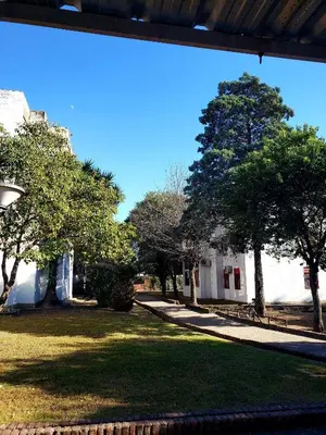 a view of a park with trees and a sidewalk at Departamento en calle 9 de Julio in Cordoba