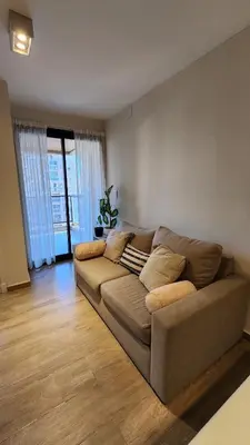a living room with a brown couch in a room at Obispo Salguero 648 - Pleno Nueva Cordoba BY Apartcba in Cordoba