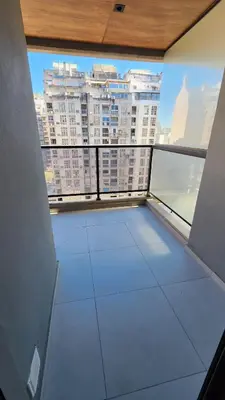 an empty room with a view of a large building at Obispo Salguero 648 - Pleno Nueva Cordoba BY Apartcba in Cordoba