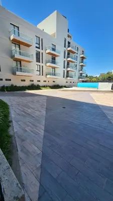 an empty parking lot in front of a building at ALLEGRA Lake Towers - Nuevo y moderno! Exc ubicación -Lo vas a amar in Villa Carlos Paz