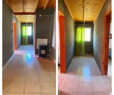 two pictures of an empty room with green and orange walls at Aires de Paz in San Roque